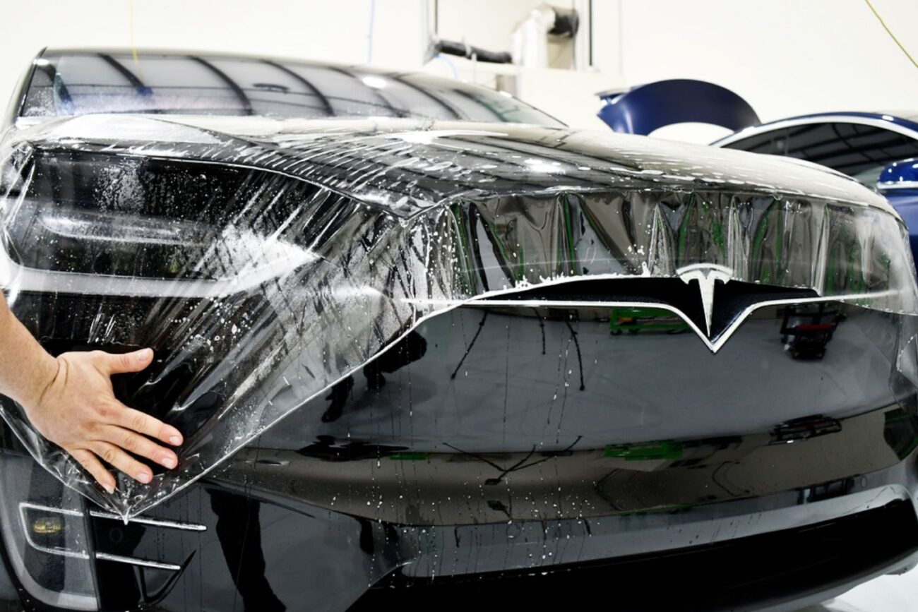 Paint protection film being installed on a Tesla Model 3 at Ceramic Garage